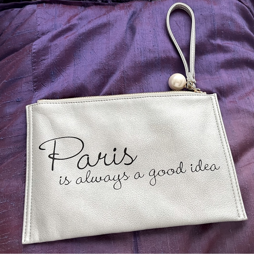 Metallic silver wristlet with faux pearl zipper detail